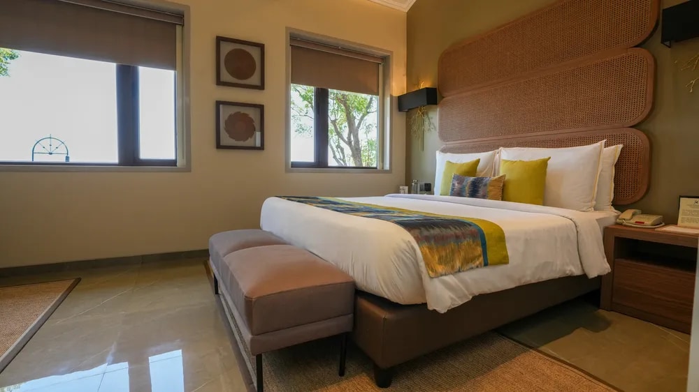 A guest bedroom with natural light at Fazlani